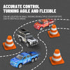 A red and blue RC racing truck is shown navigating around orange traffic cones on a gray surface.