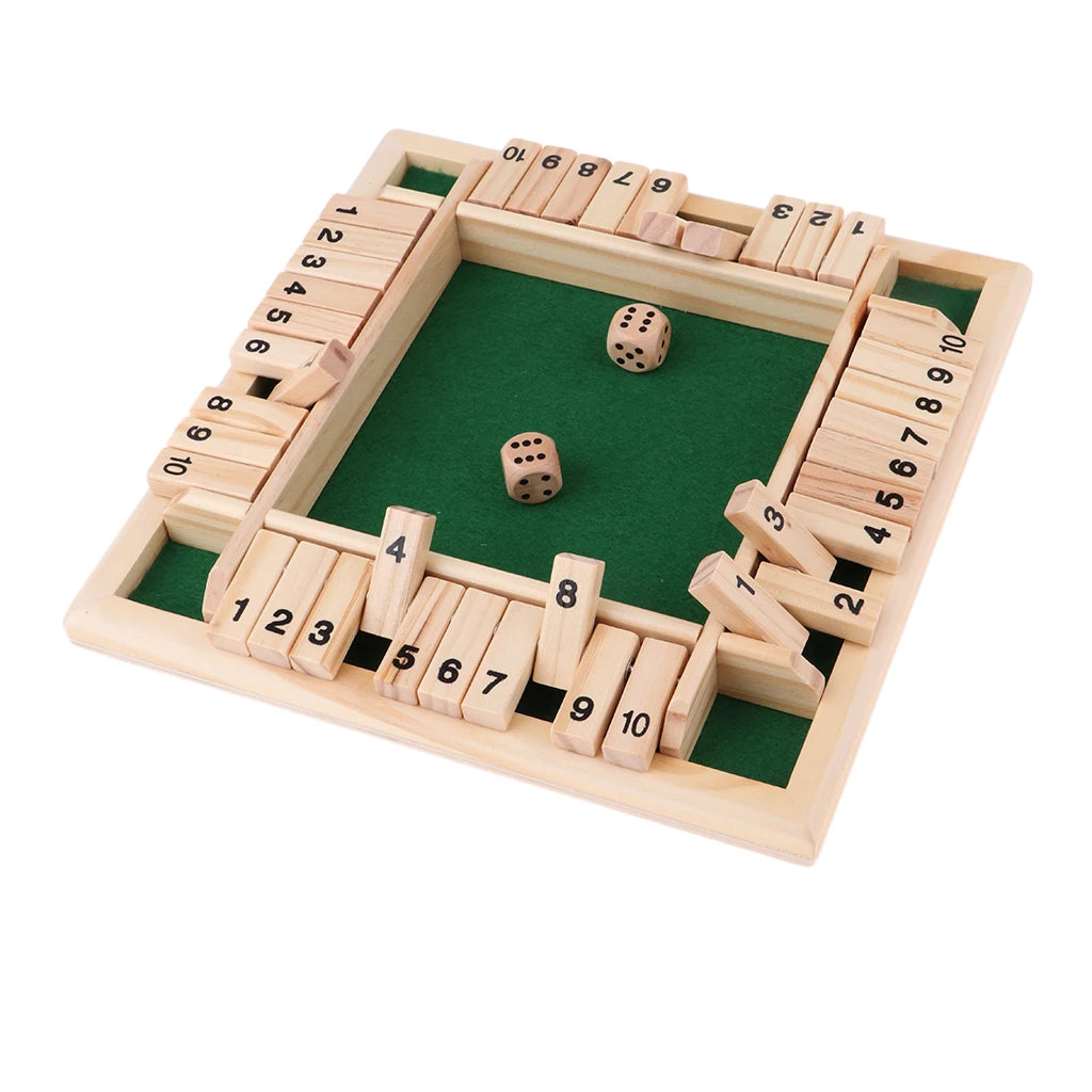 A wooden board game for four players featuring dice and numbered wooden blocks set up in a box structure.