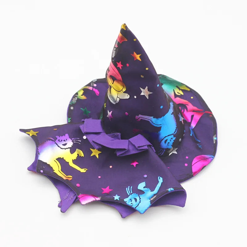 A purple witch hat and matching fabric costume set featuring colorful stars and animal designs for dolls.