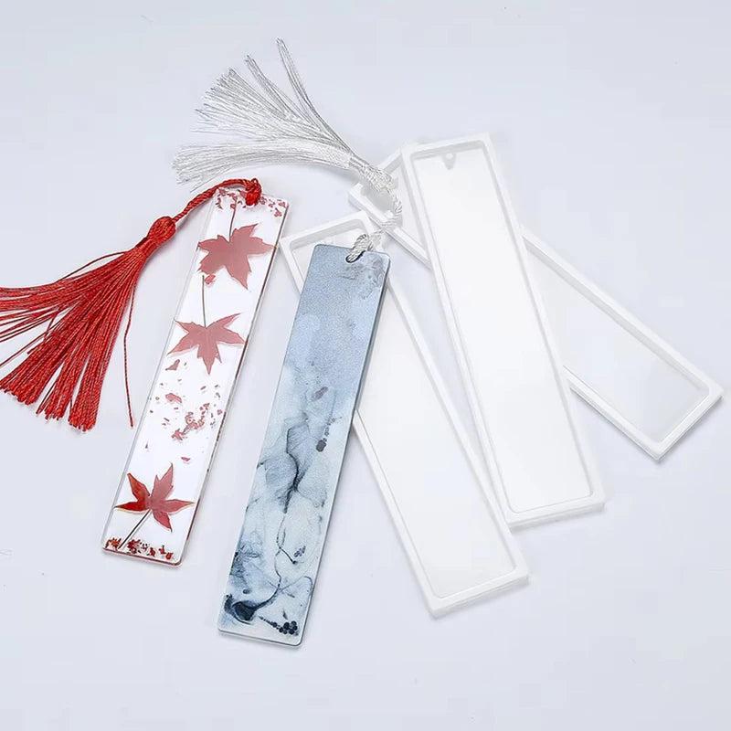 Flexible silicone molds for resin bookmarks featuring maple leaf designs in red and blue tones