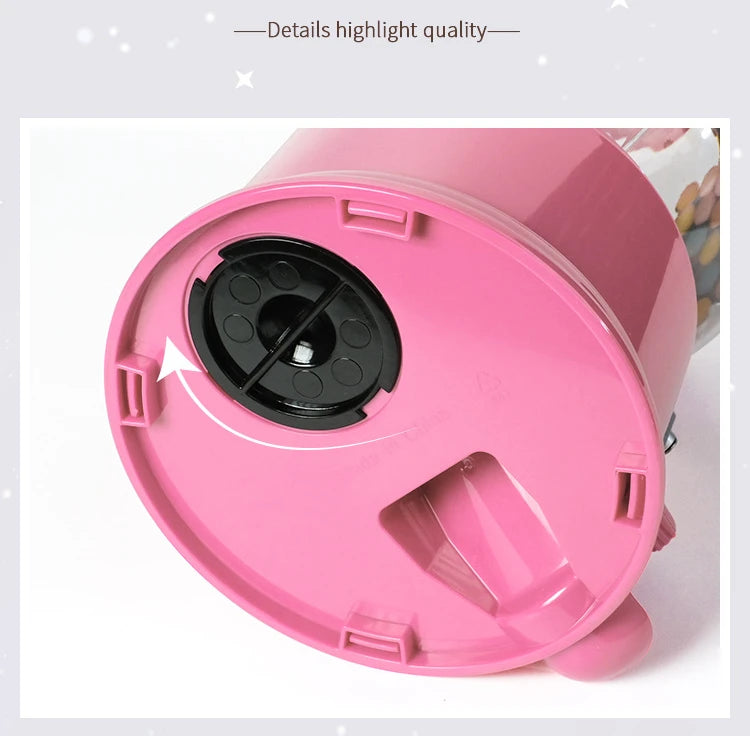 Pink kids candy dispenser piggy bank with gumball fun featuring a clear dispensing window