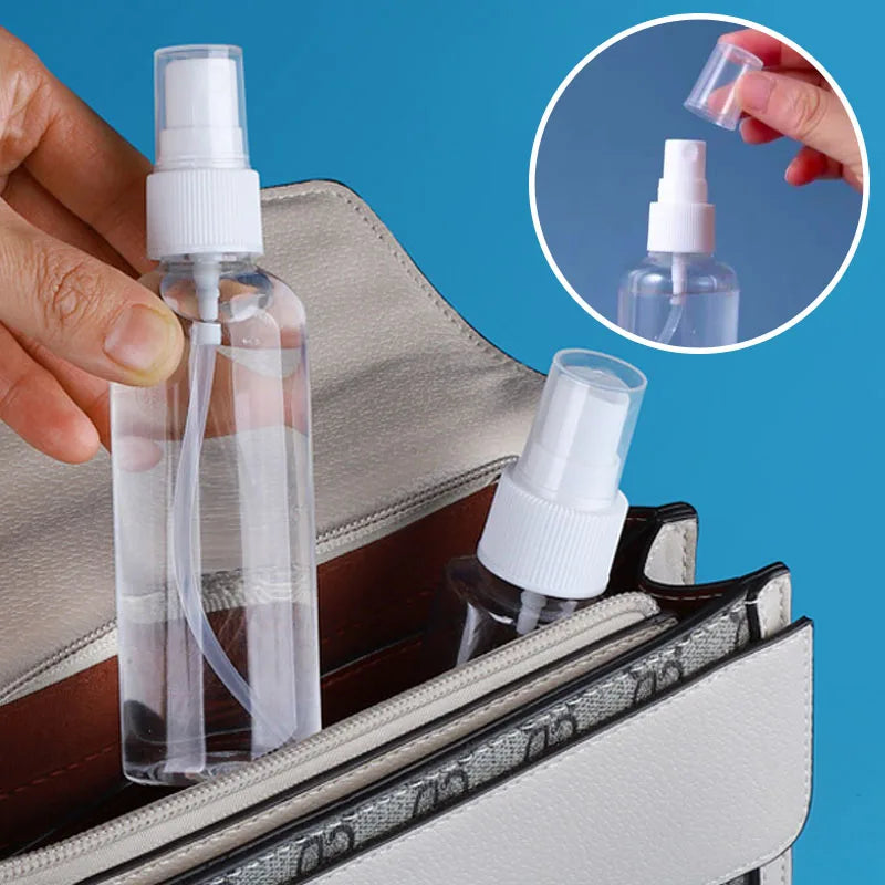 A hand is holding a clear refillable travel spray bottle with a fine mist pump, placed inside a leather-trimmed pouch.
