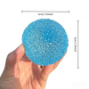 A hand holds a light blue, textured squishy ice ball fidget toy with dimensions of 6cm/2.36inch.