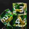 A set of green resin dice featuring golden elven numbers, including a three and a four.