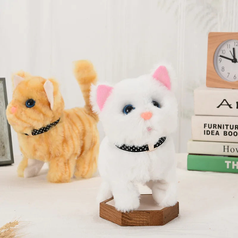 A white fluffy plush cat toy sitting on a wooden base next to an orange plush cat toy.