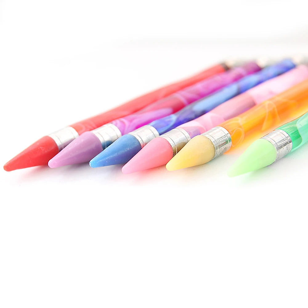 A collection of double-head diamond painting pens in various bright colors, laid diagonally on a white background.