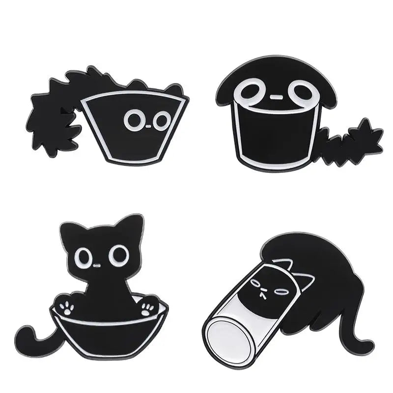 A set of four black cat enamel pins featuring various stylized cat faces and silhouettes.