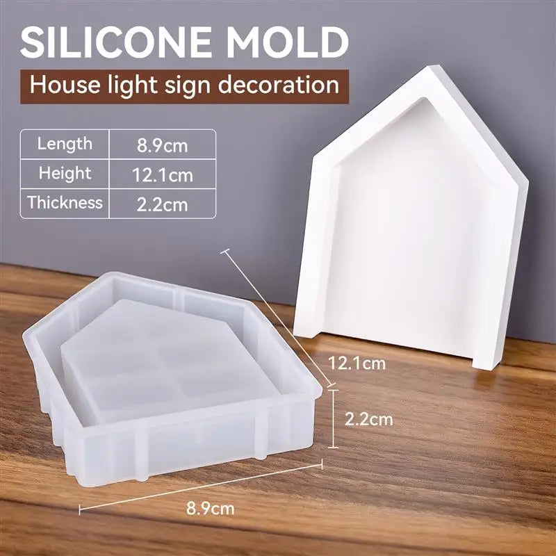 White silicone mold for a house light sign decoration with dimensions 8.9cm long, 12.1cm high, and 2.2cm thick.