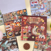 A box of Kawaii Embroidery-Style Sticker Book containing various themed stickers and illustrations.