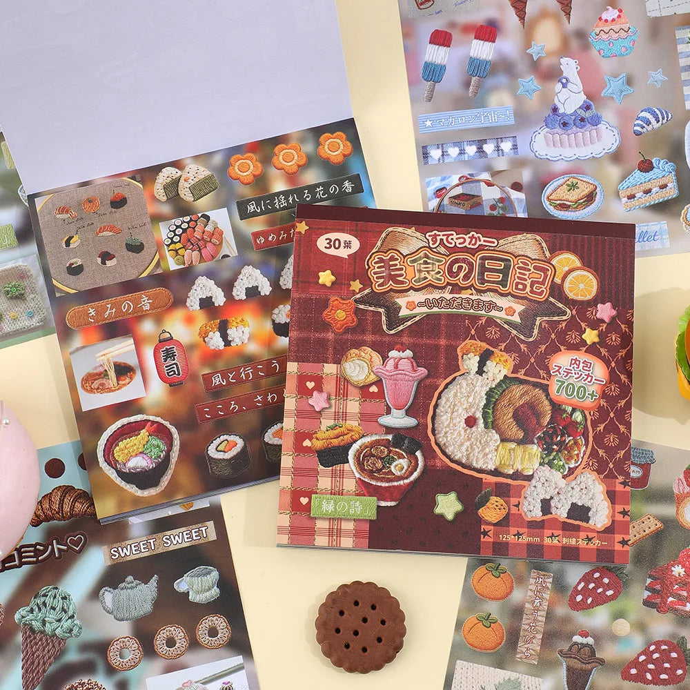 A box of Kawaii Embroidery-Style Sticker Book containing various themed stickers and illustrations.