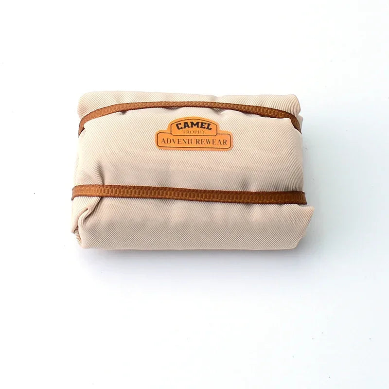 A beige roof bag and bedroll decoration set for a 1/18 or 1/24 RC crawler.
