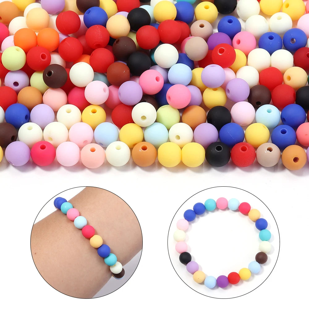 A large assortment of colorful matte acrylic beads in various shades and sizes for DIY jewelry making