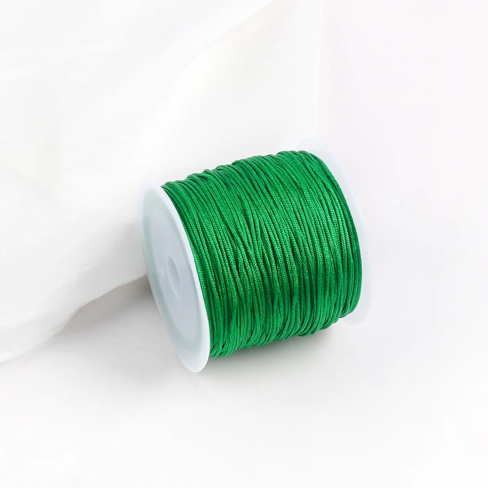A roll of bright green 0.8mm cotton nylon macrame cord for jewelry making and crafts.