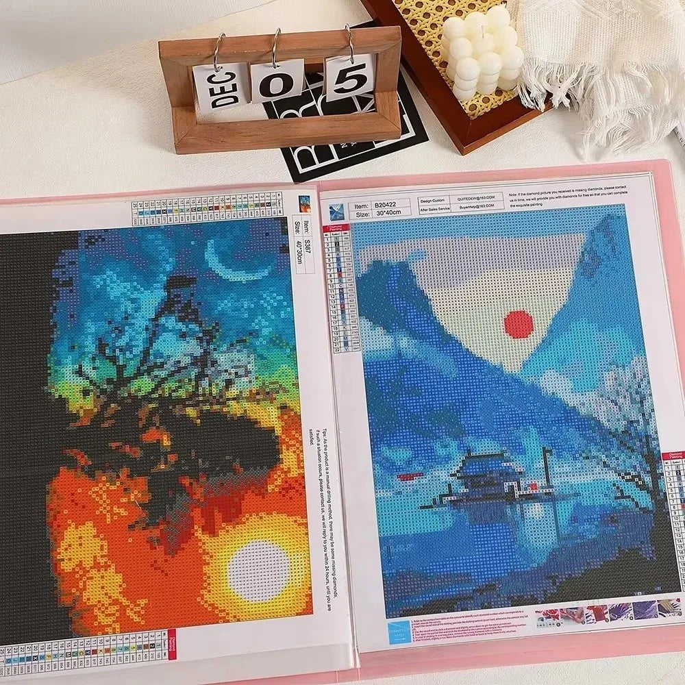 A transparent diamond painting storage album displaying two colorful finished paintings.