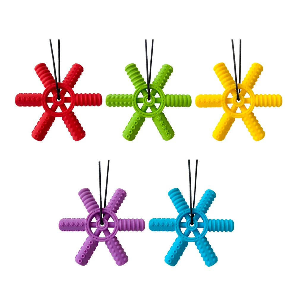 A set of five silicone steering wheel teethers in red, green, yellow, purple, and blue.
