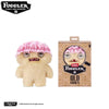 A plush toy of a monster with pink hair and large eyes, featuring the Fuggler brand.