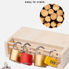 A wooden lock and key toy set featuring brass, red, and yellow locks and keys displayed next to a wooden box.