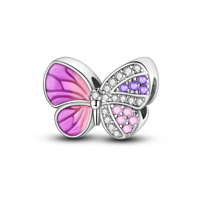 A heart-shaped charm bead made of 925 sterling silver with pink zircon stones.