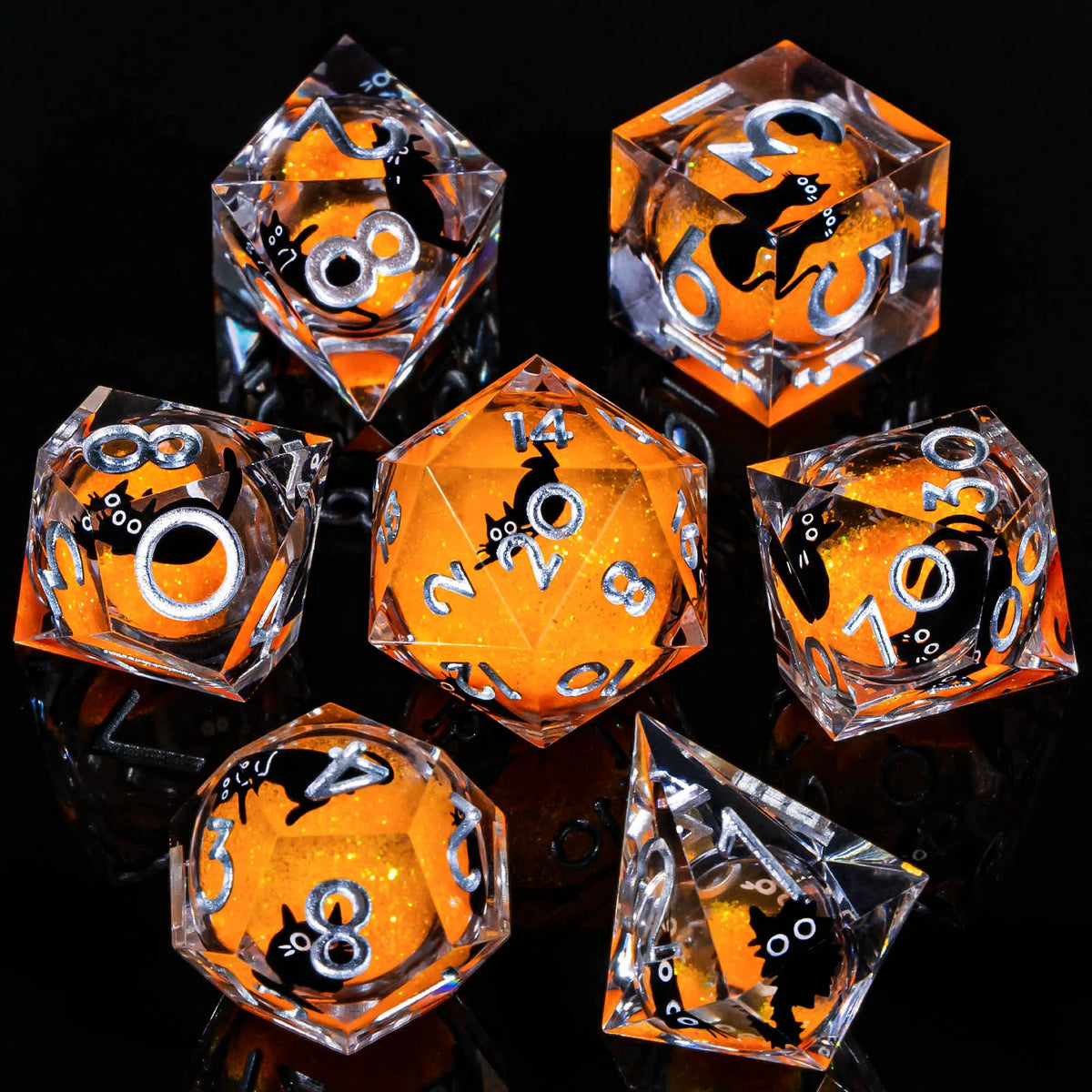 A set of ten translucent orange and black liquid core resin dice arranged on a reflective surface.
