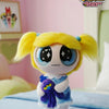 A collectible figure of Blossom from The Powerpuff Girls, featuring blonde hair and blue accents.