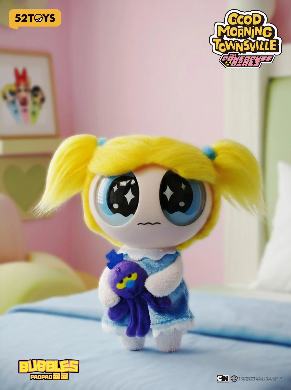 A collectible figure of Blossom from The Powerpuff Girls, featuring blonde hair and blue accents.