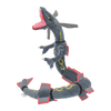 A plush toy of Shiny Rayquaza, a gray and yellow dragon, is shown in a dynamic pose.