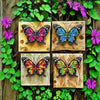 Set of four decorative iron butterfly wall art pieces set against a green foliage background