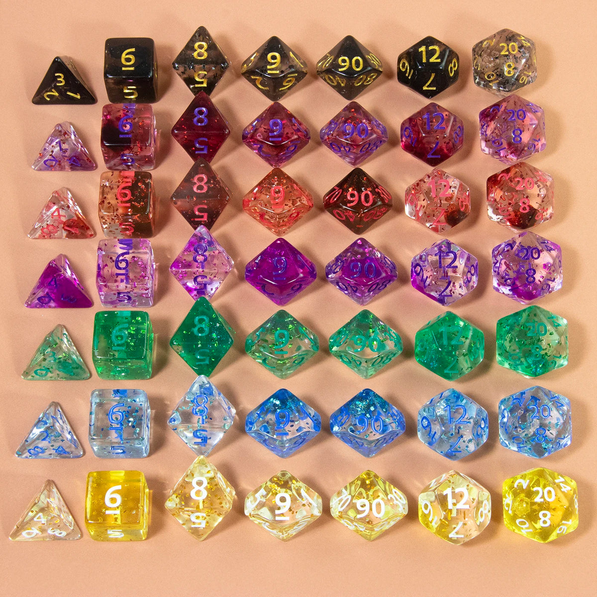 A collection of glitter polyhedral dice in various colors and sizes, including D4, D6, D8, D10, D12, and D20.