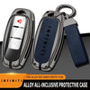A silver zinc alloy protective case cover for an Infiniti key, showing the interior and a separate strap.