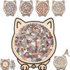 A collection of cat-shaped wooden jigsaw puzzles featuring various cats and animals.