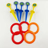 A set of five colored plastic stakes and five rings for a classic ring toss game.