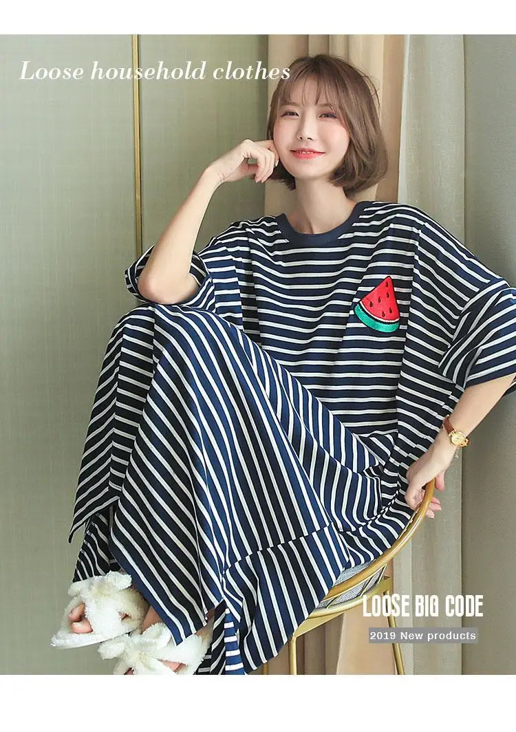 A woman models a loose striped short-sleeve lounge dress featuring a watermelon design.