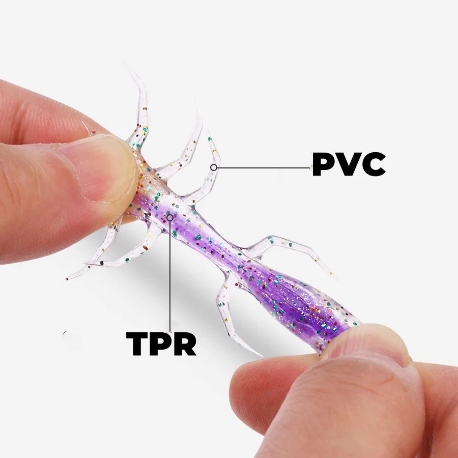 A hand holds a flexible fishing lure featuring PVC and TPR components, designed as a realistic spider soft bait.