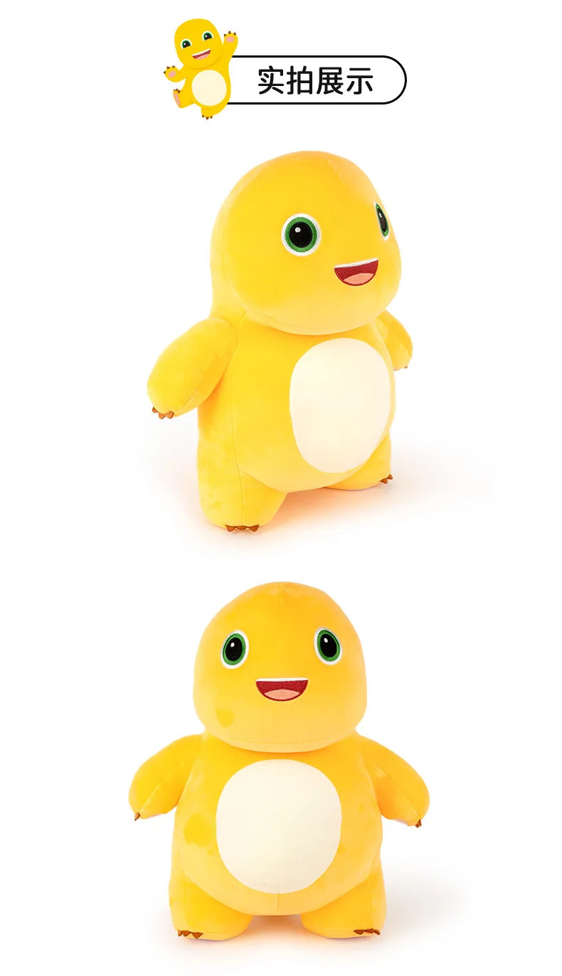 A yellow, soft plush toy of a cute dinosaur or milk dragon with large eyes and a smiling mouth.