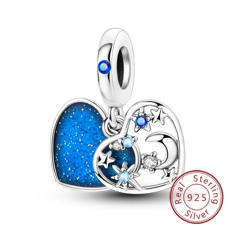 Sterling silver heart charm with a blue gemstone and stars, designed for bracelets.