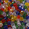 A close-up view of a mixed assortment of faceted rondelle glass beads in various colors like red, green, yellow, and blue.