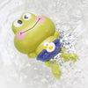 A yellow swimming frog toy is splashing in clear water.
