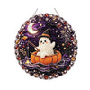 A diamond painting hanging ornament featuring a white ghost in a pumpkin with a witch hat against a starry purple background.