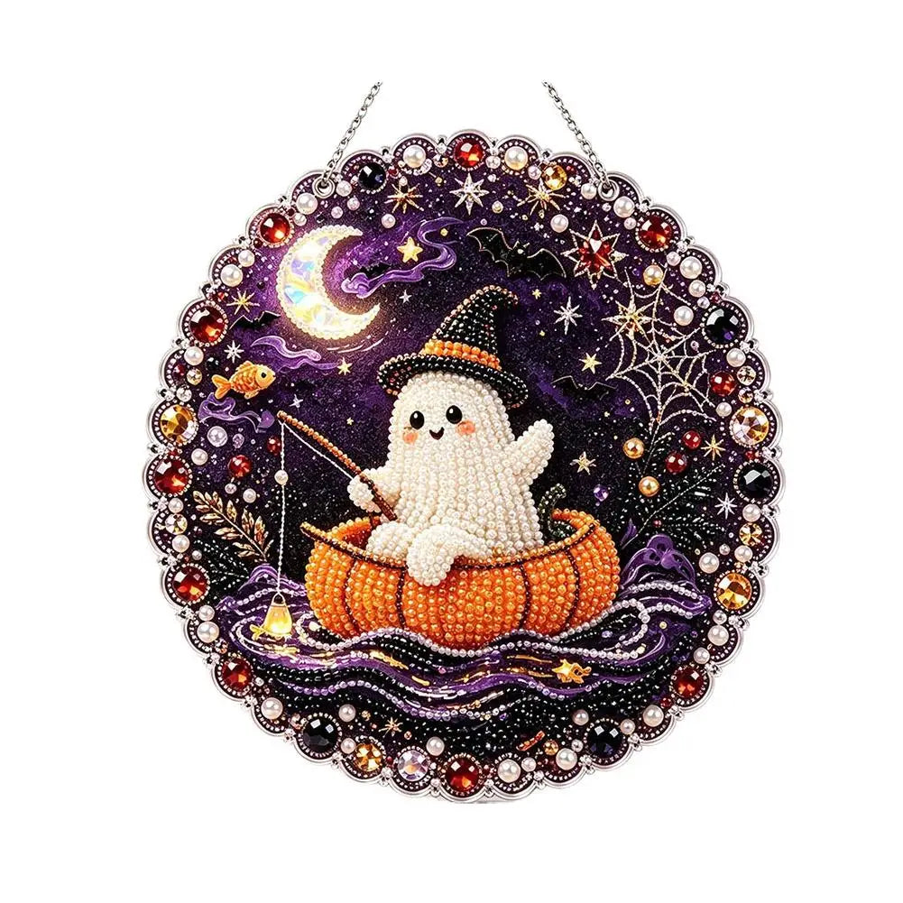 A diamond painting hanging ornament featuring a white ghost in a pumpkin with a witch hat against a starry purple background.