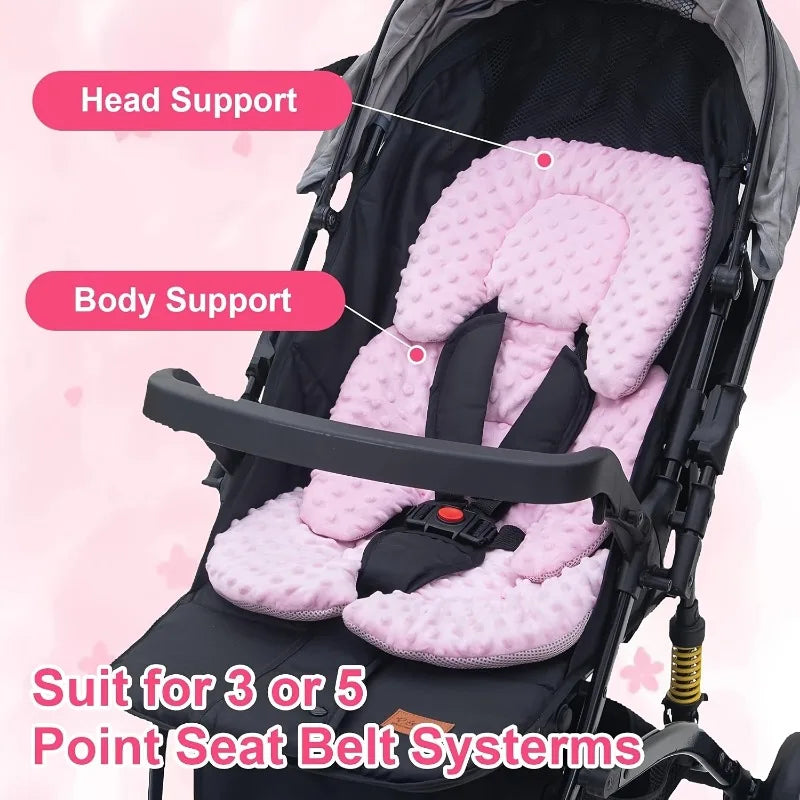 A pink plush seat cushion with head and body support is shown inside a stroller seat, suitable for 3 or 5 point seat belt sys