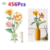 A set of 456 floral building blocks featuring yellow and pink flowers arranged in a bouquet display.