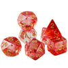 A set of seven polyhedral dice with a red and pink haze swirl effect for role-playing games