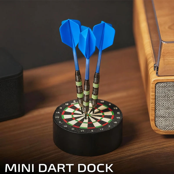 A mini dart dock with three blue foam darts mounted on it, resting on a wooden surface.