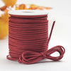 Roll of reddish-brown velvet faux suede braided ribbon for crafting and gift wrapping