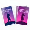 A purple box of the Lovers Messages Oracle deck with a silhouette of two people standing on a dark landscape.