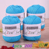 Four skeins of bright blue cotton knitting yarn for crochet and handmade projects