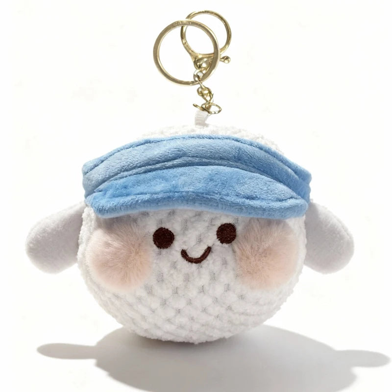 A small, light blue fabric hat plush charm with a gold-colored keychain attached.