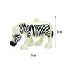 A white zebra-themed building block figure with black stripes, shown from the side.