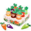 A box of soft pulling carrot sensory toys featuring various colored carrots and vegetables for babies.