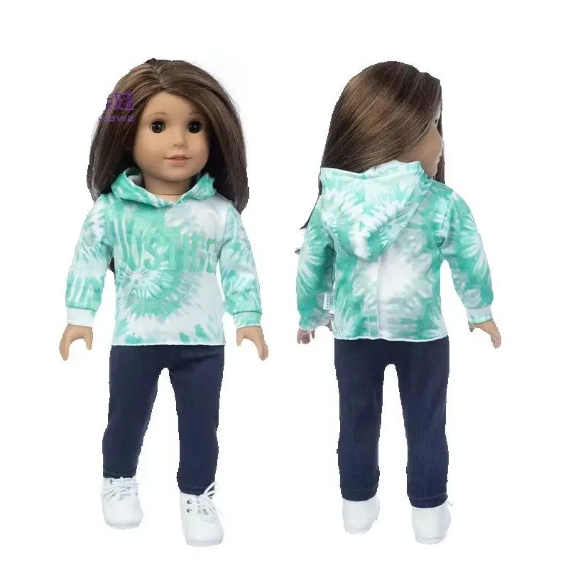 A doll wearing a light green and white hoodie outfit with dark pants and tights.